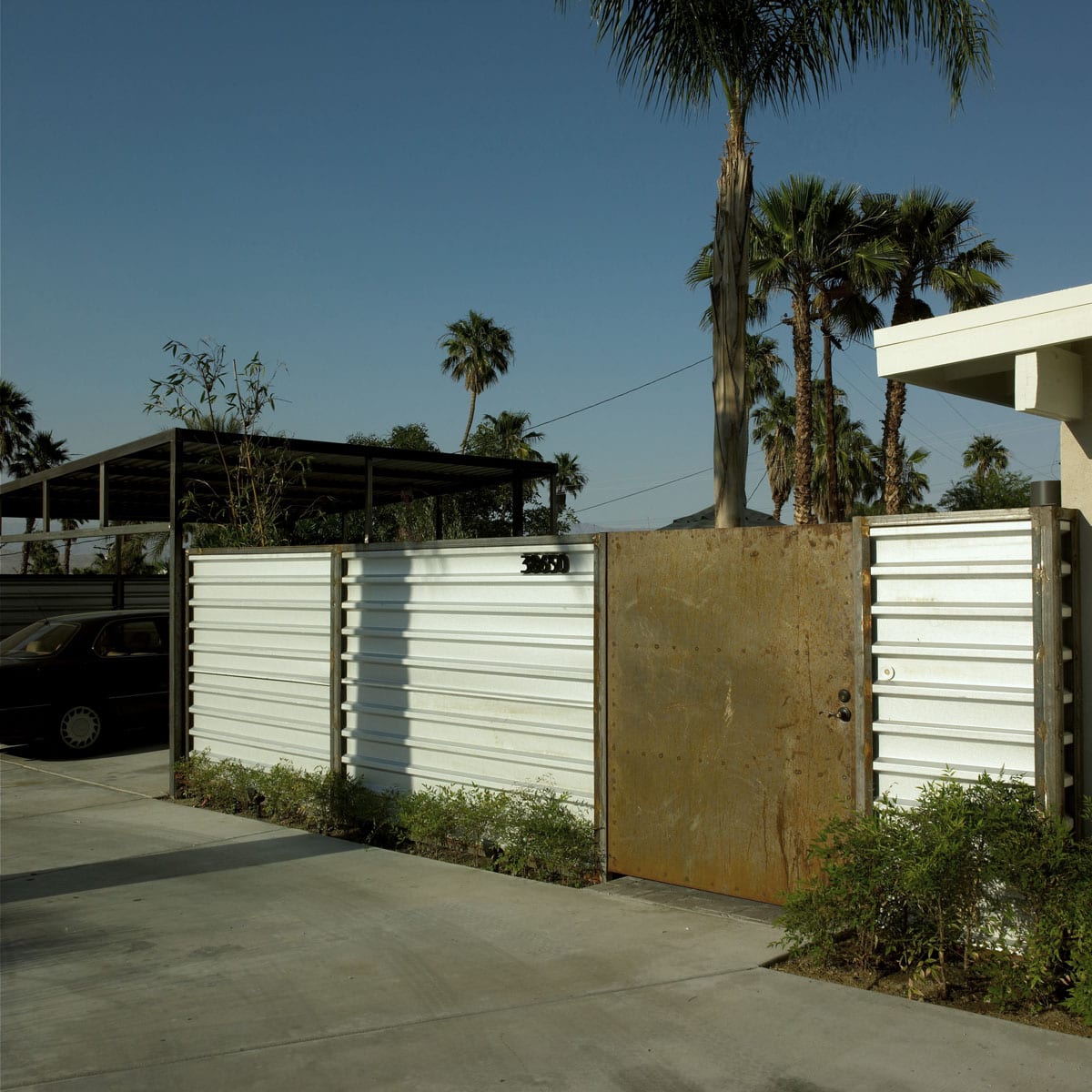 Rusted Steel and Galvinized Metal Fence Carport